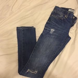 Distressed slouchy slim Charlotte Russe jeans